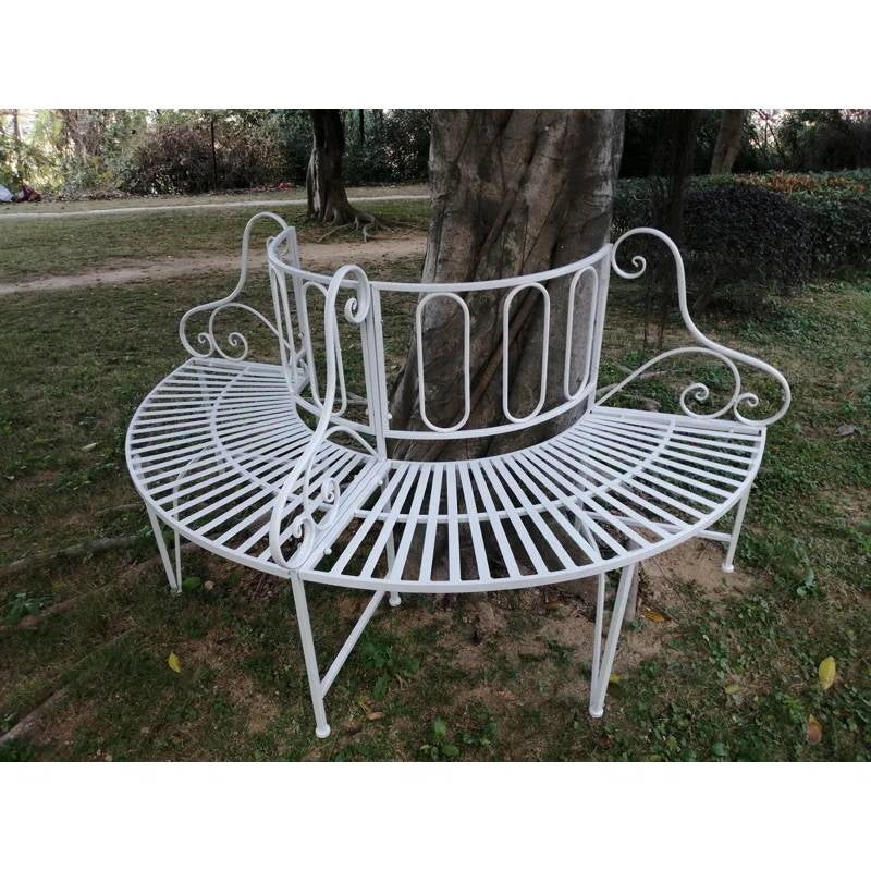 Half-Circle White Metal Outdoor Patio Garden Tree Bench with elegant design and intricate detailing placed around a tree.