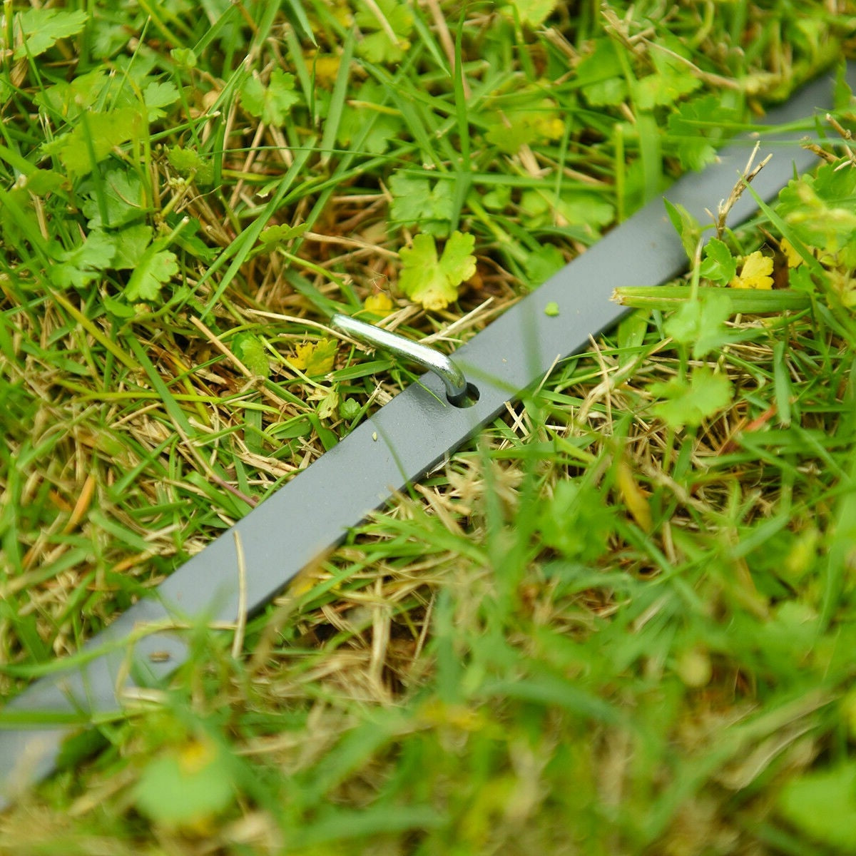 Steel footing for 10 x 10 Ft Outdoor Steel Frame Gazebo Shelter with Waterproof Polyester Canopy on grassy ground