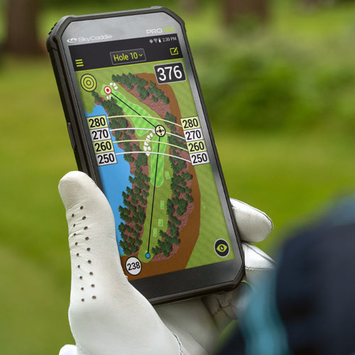 Golfer using SkyCaddie® PRO 5X with TruePoint Precision Technology on a golf course