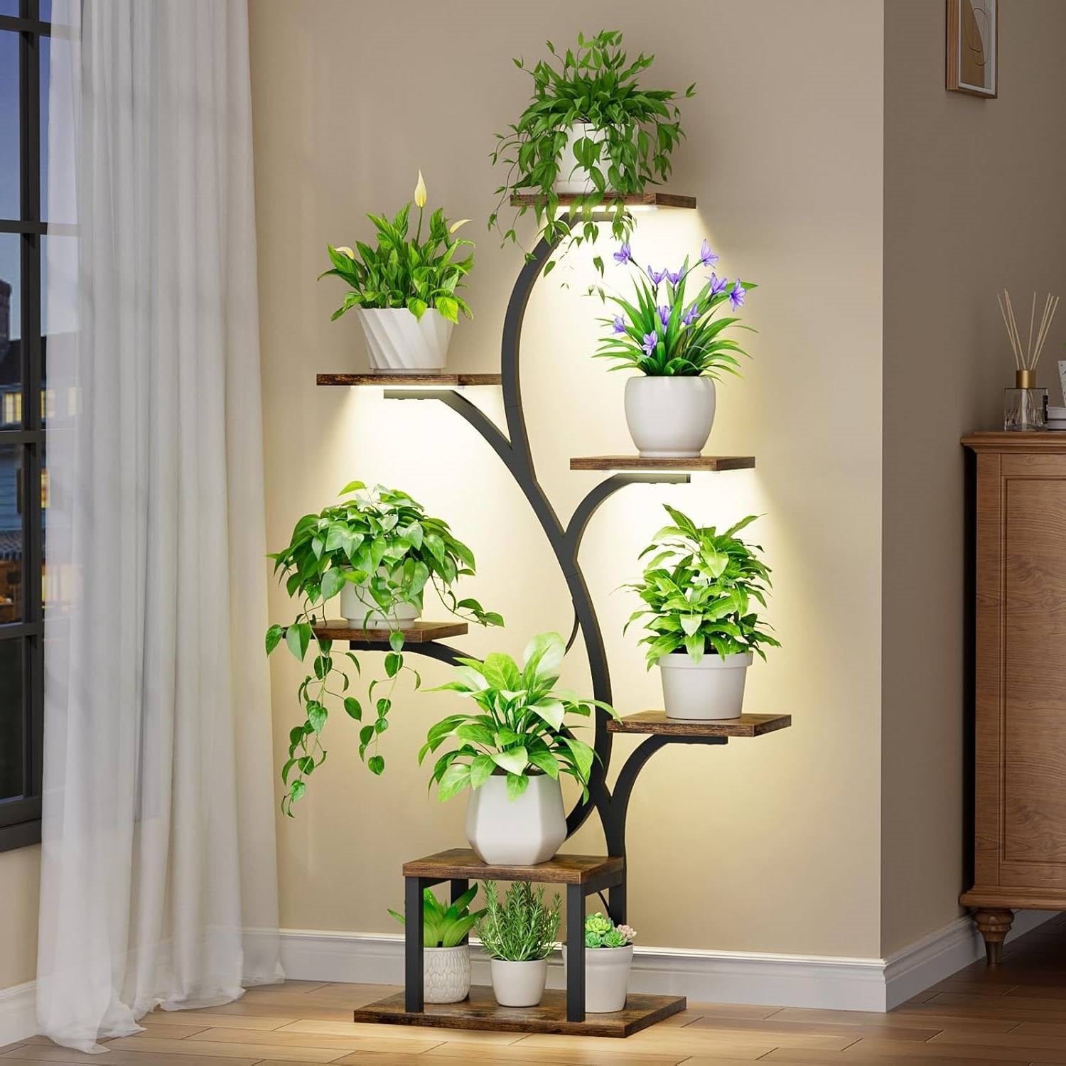 Modern 49-inch Tall Indoor Plant Stand Display Shelf with Grow Lights showcasing plants in a living room setting.