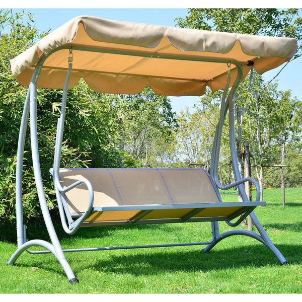 Sturdy 3-Person Outdoor Patio Porch Canopy Swing in Sand Color on green lawn with trees