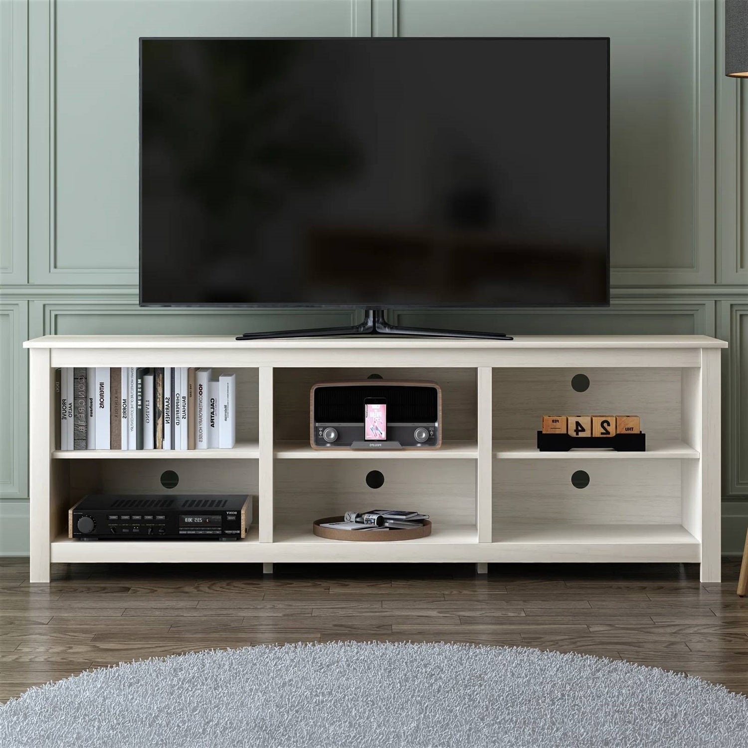 Farmhouse TV Stand in White Wood Grain Finish - for TVs up to 70-inch with shelves and decor items displayed