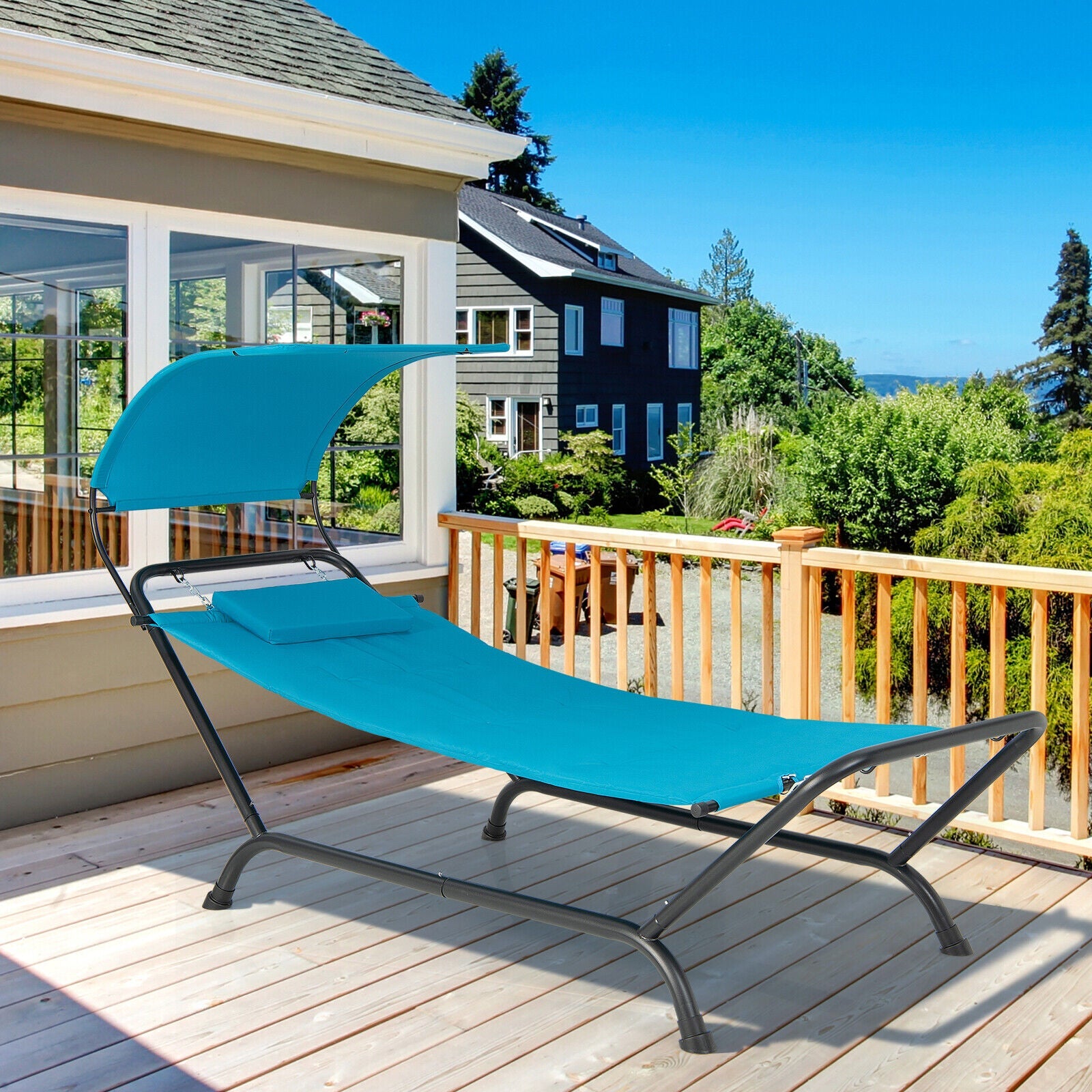 Patio Hanging Chaise Lounge Chair with Canopy Cushion Pillow and Storage Bag-Navy on a sunny deck view