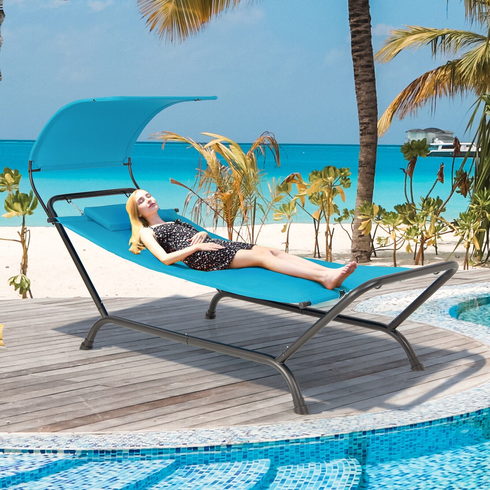 Patio Hanging Chaise Lounge Chair with Canopy Cushion Pillow and Storage Bag-Navy on a tropical deck by the beach