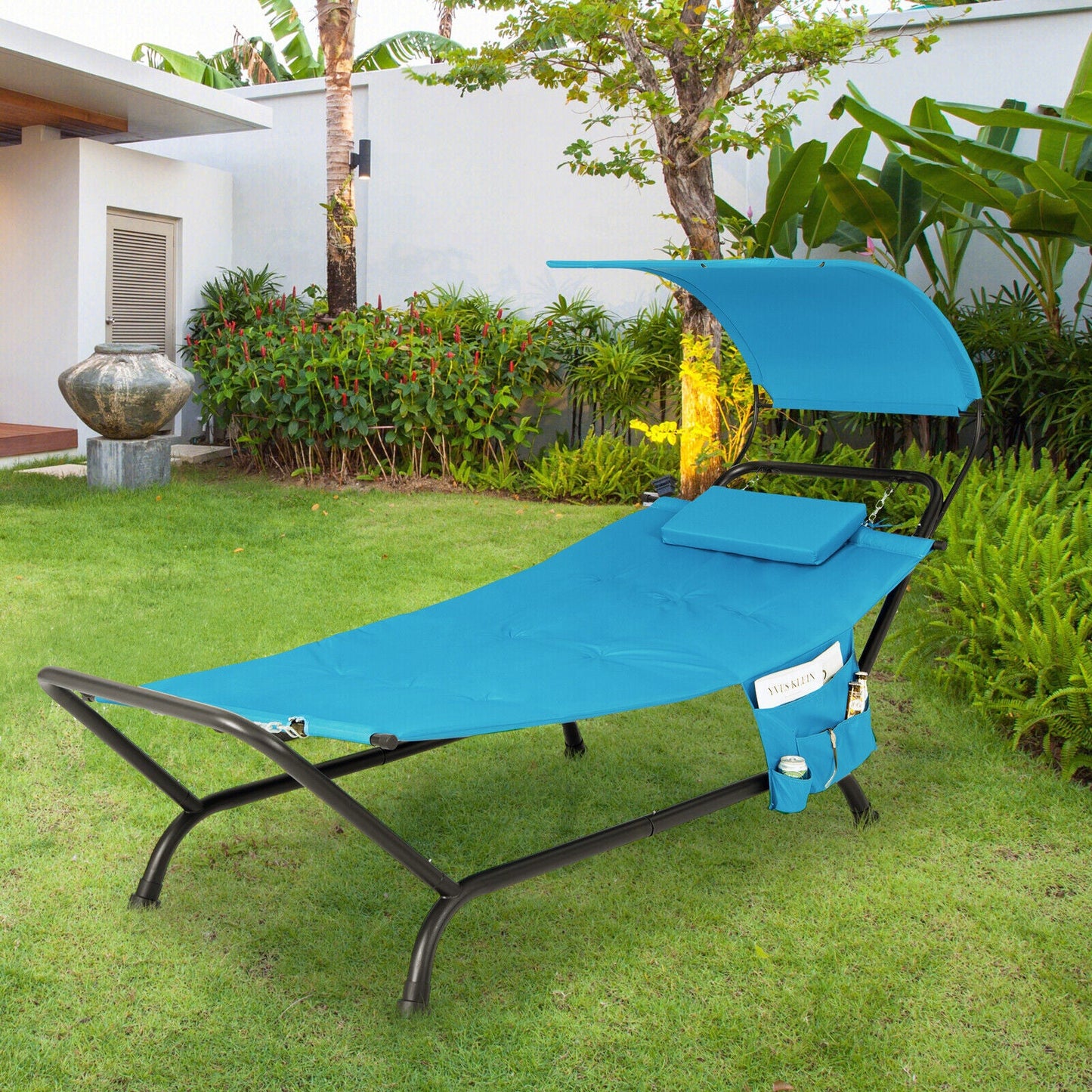 Patio Hanging Chaise Lounge Chair with Canopy Cushion Pillow and Storage Bag-Navy in a garden setting