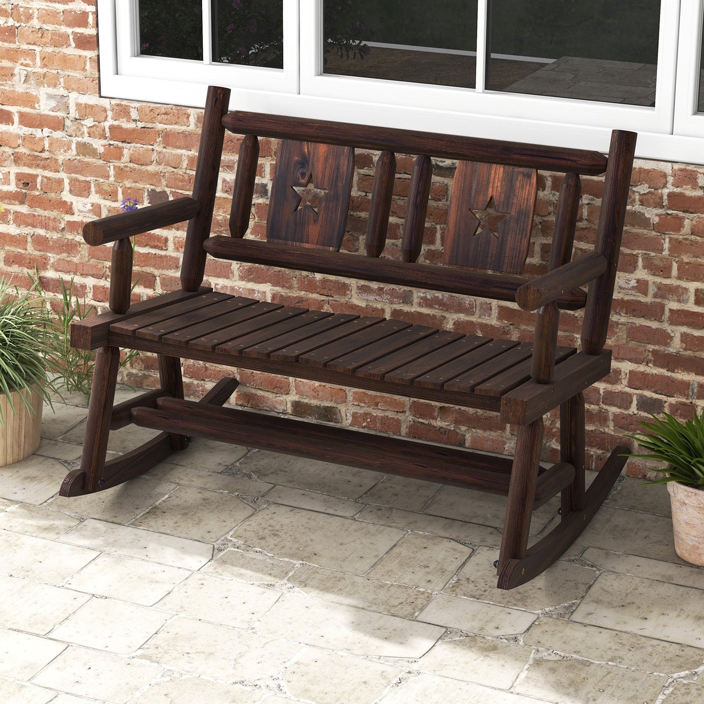 Patio Rocking Bench Double Rocker Chair with Ergonomic Seat 2-Person Loveseat; rustic design on a porch with brick wall backdrop.