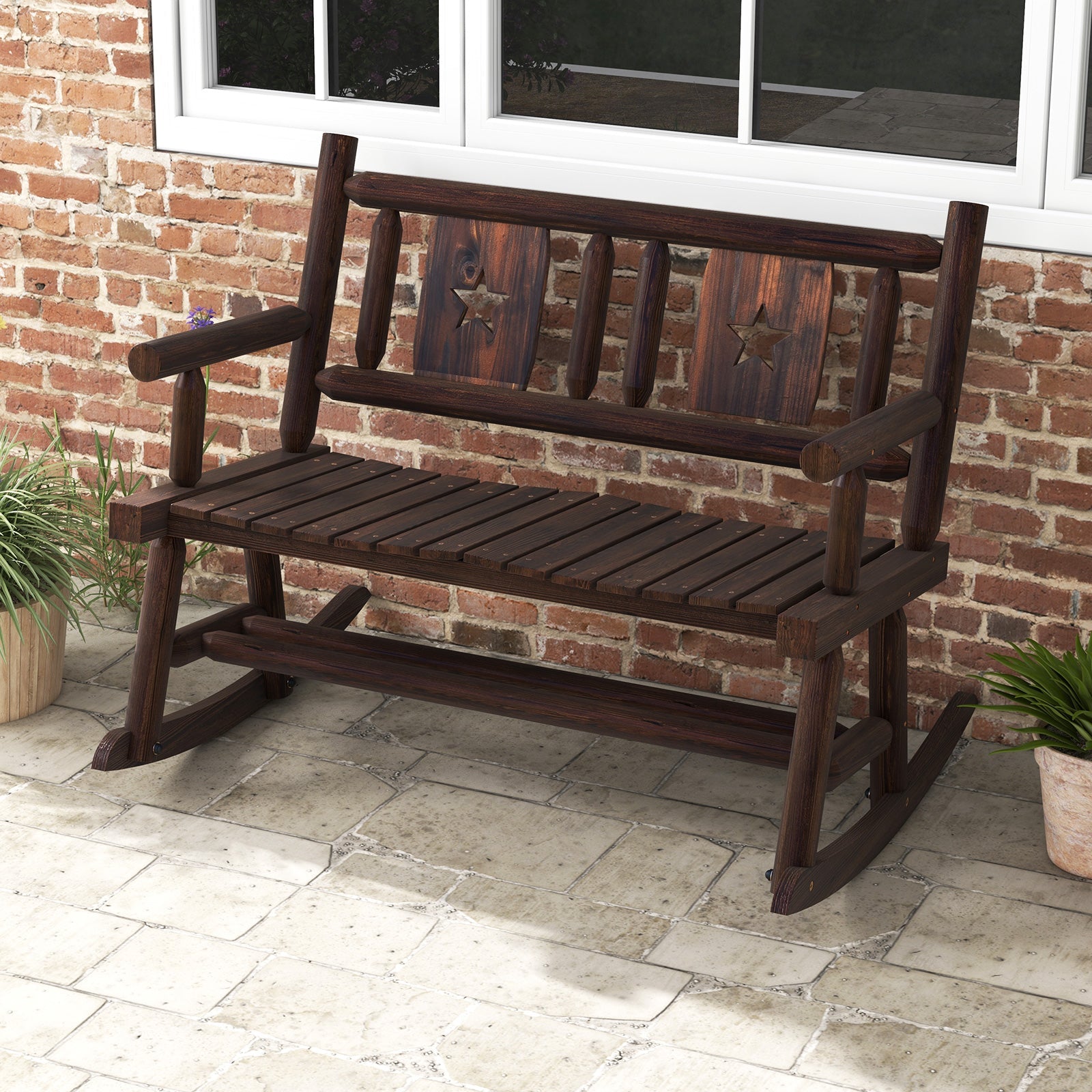 Patio Rocking Bench Double Rocker Chair with Ergonomic Seat 2-Person Loveseat; rustic design on a porch with brick wall backdrop.