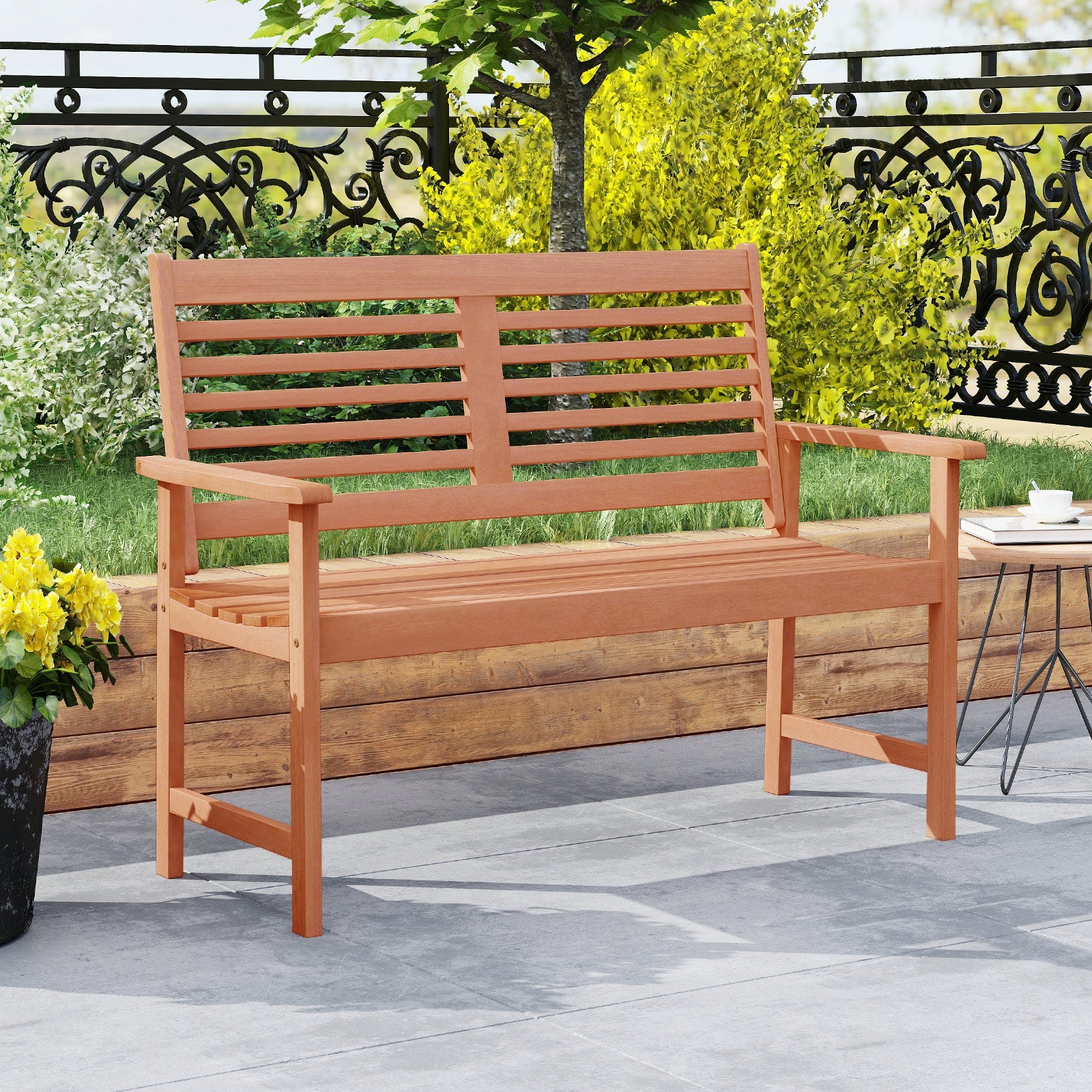Patio Solid Wood Loveseat Outdoor 2-Seat Bench with Inclined Backrest and Slatted Seat in a garden setting