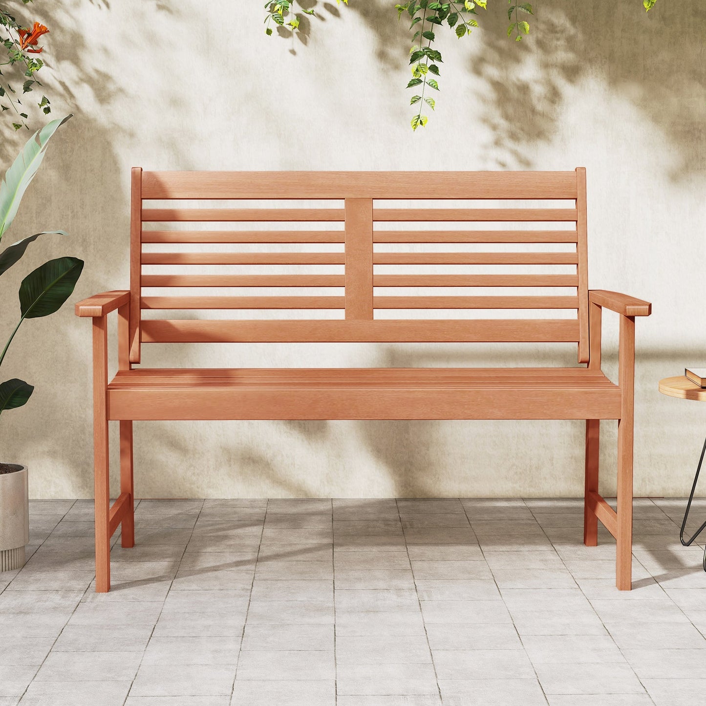 Patio Solid Wood Loveseat Outdoor 2-Seat Bench with Inclined Backrest and Slatted Seat on a sunny patio