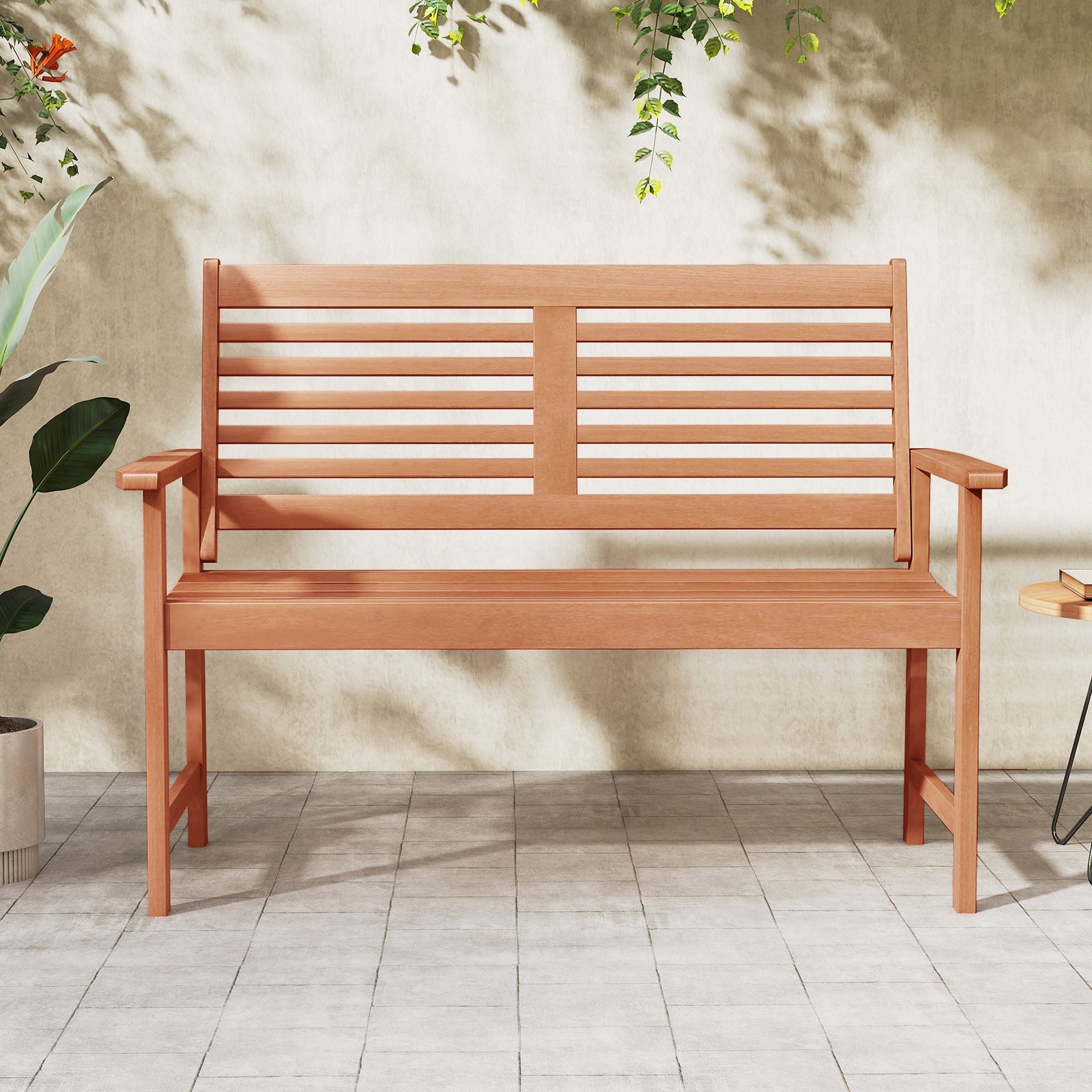 Patio Solid Wood Loveseat Outdoor 2-Seat Bench with Inclined Backrest and Slatted Seat on a sunny patio
