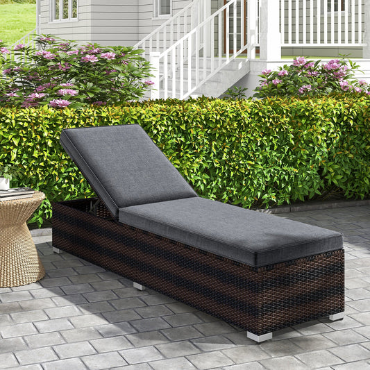 Patio Wicker Lounge Chair with 4-level Backrest and Long Seat Cushion-Brown in outdoor setting with greenery backdrop