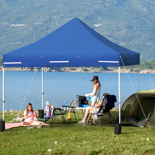 10 x 10 Feet Pop-up Gazebo with 5 Removable Zippered Sidewalls and Extended Awning-Blue providing sunshade by a lake