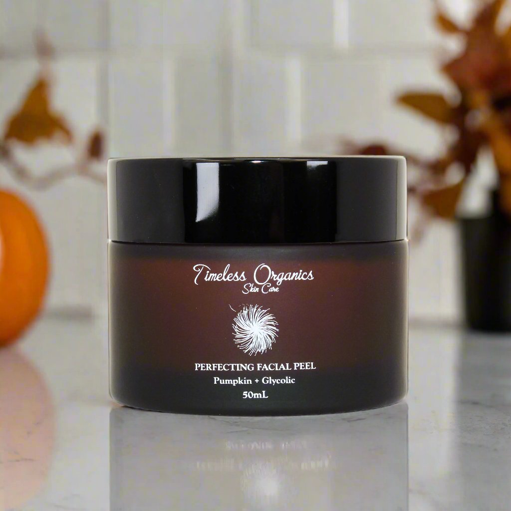 Pumpkin + Glycolic Facial Peel in amber jar with product label on a bathroom counter
