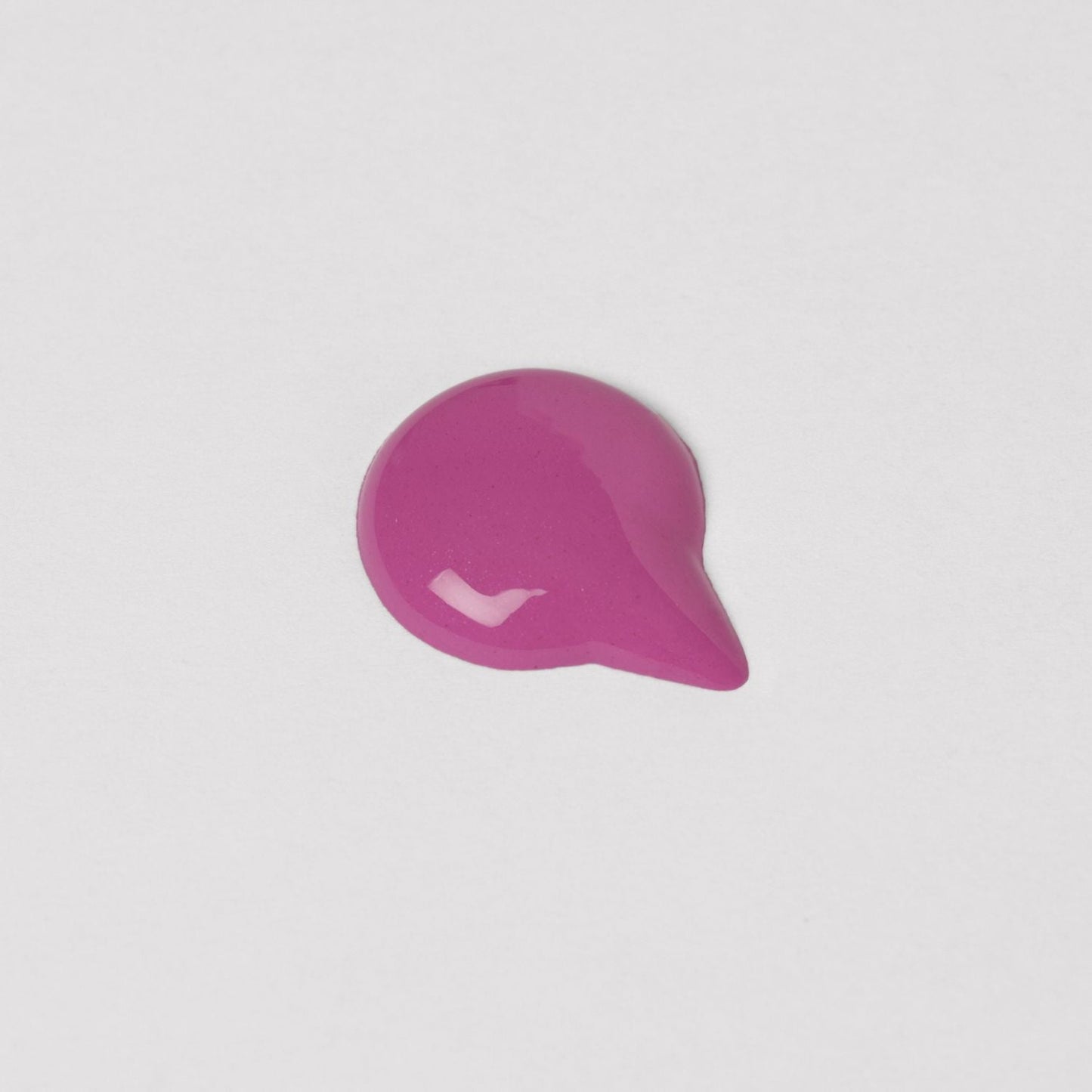Vegan Lip Gloss Wand swatch in vibrant pink for a high-shine, non-sticky finish, perfect for layering or solo wear.