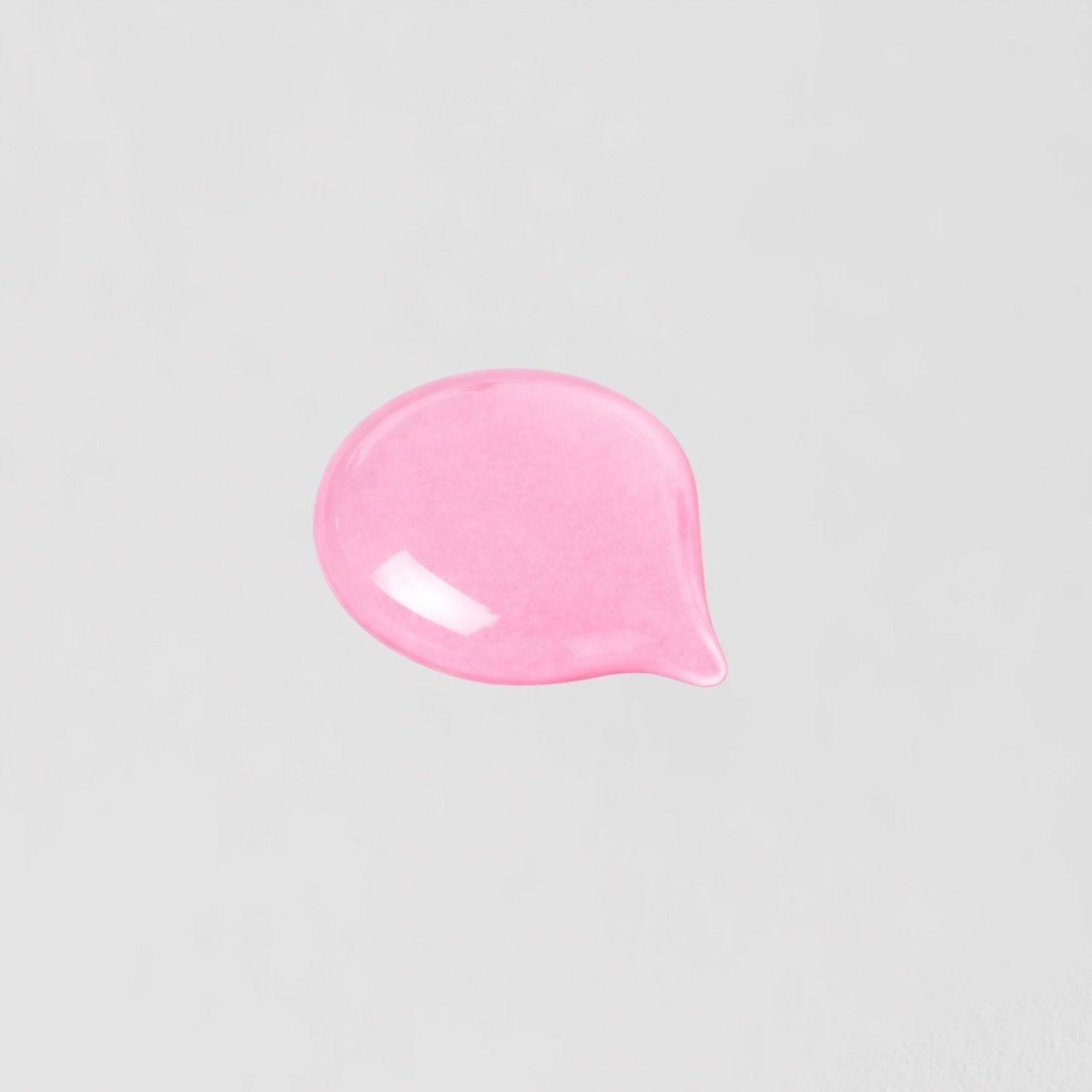 Swatch of vegan Lip Gloss Wand with a pink, high-shine finish that nourishes and smooths lips.