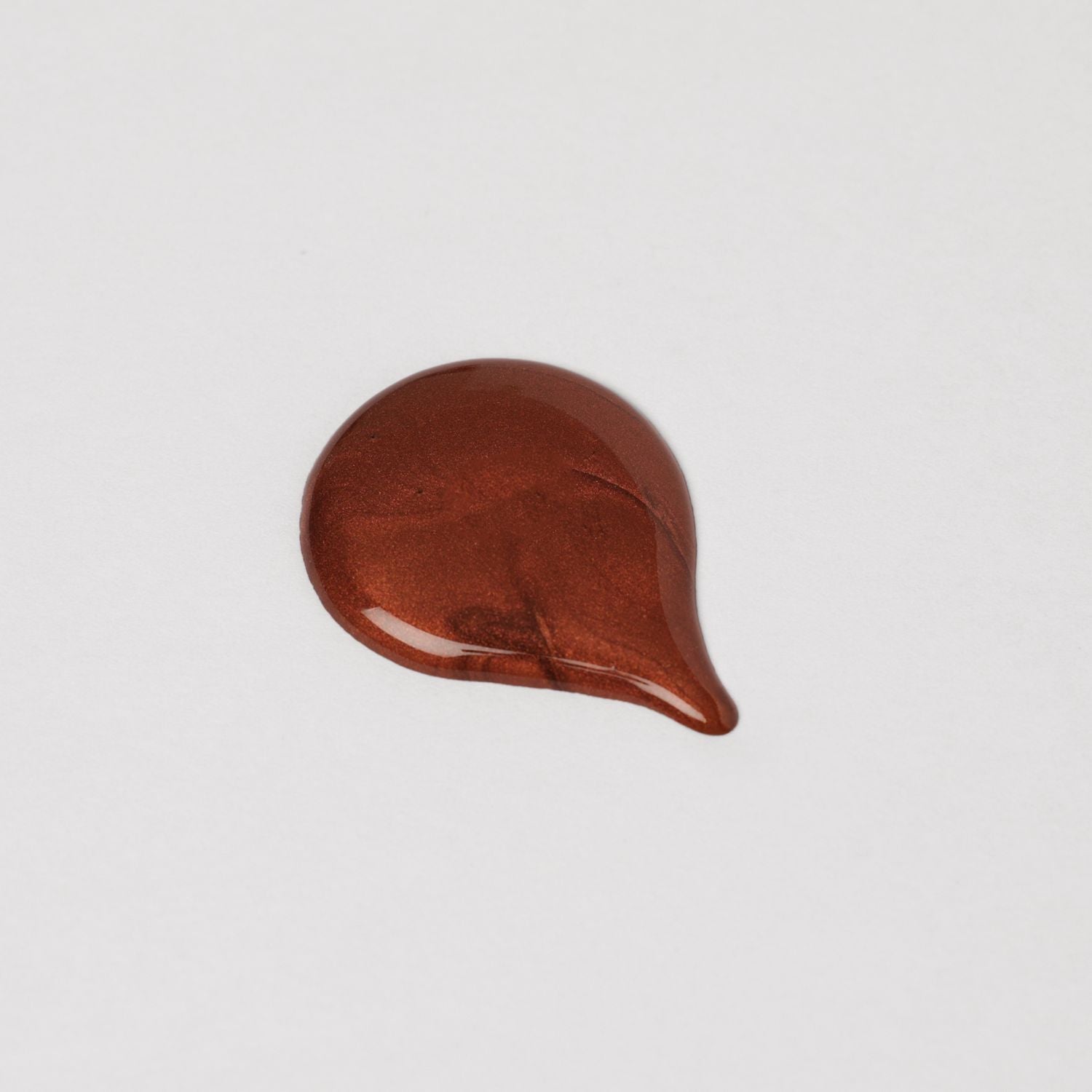 Rich brown swatch of Lip Gloss Wand showcasing high-shine finish and smooth texture on white background.