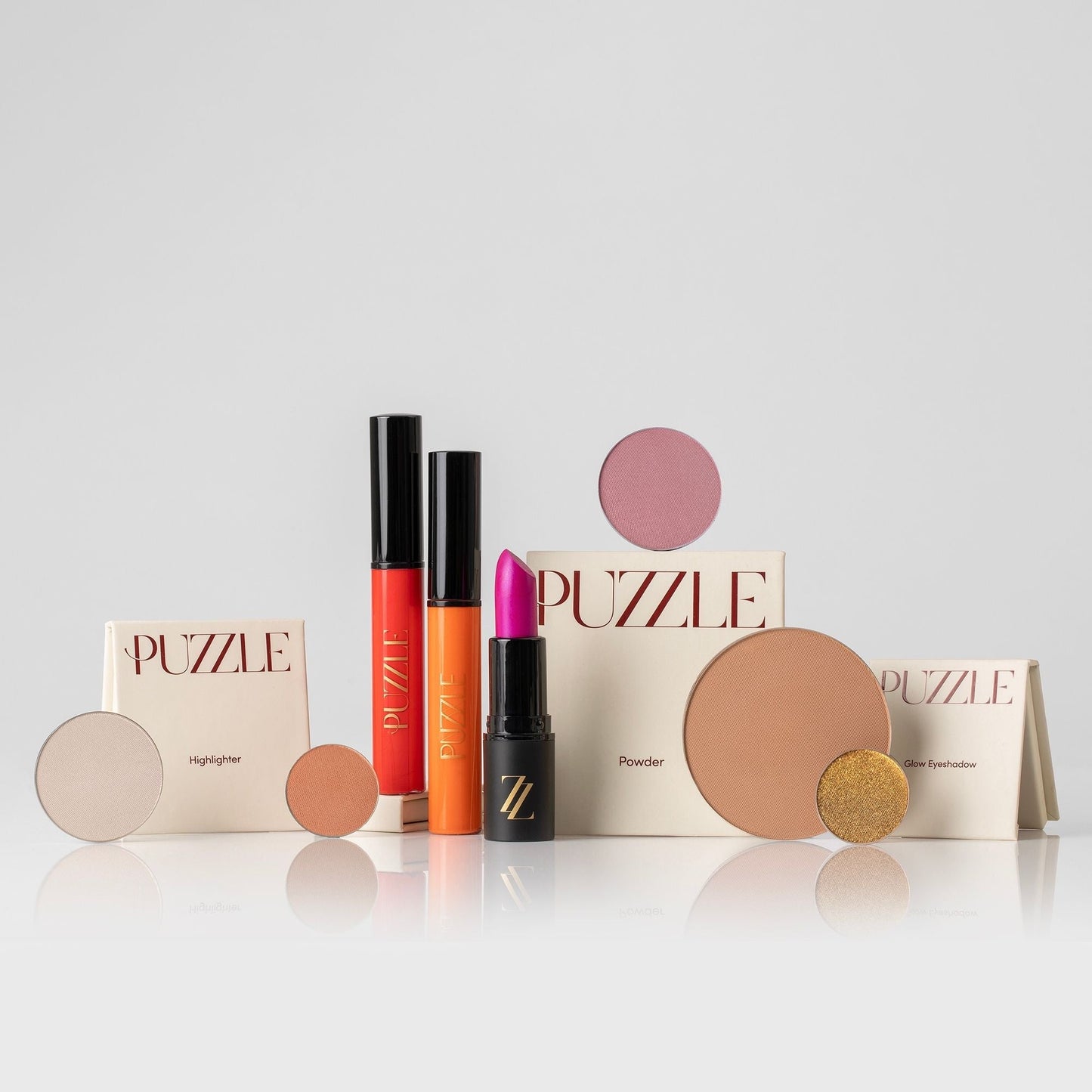 The Essentials Set featuring makeup kit with lipstick, lip gloss, highlighter, powder, eyeshadow for a polished look.