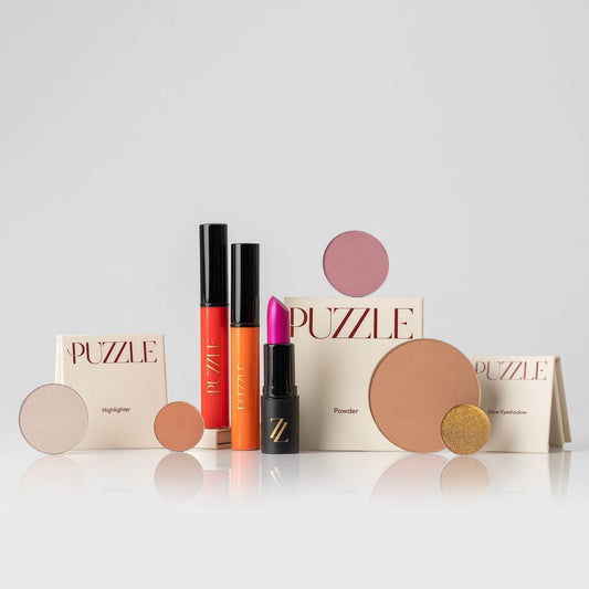 The Essentials Set featuring makeup kit with lipstick, lip gloss, highlighter, powder, eyeshadow for a polished look.