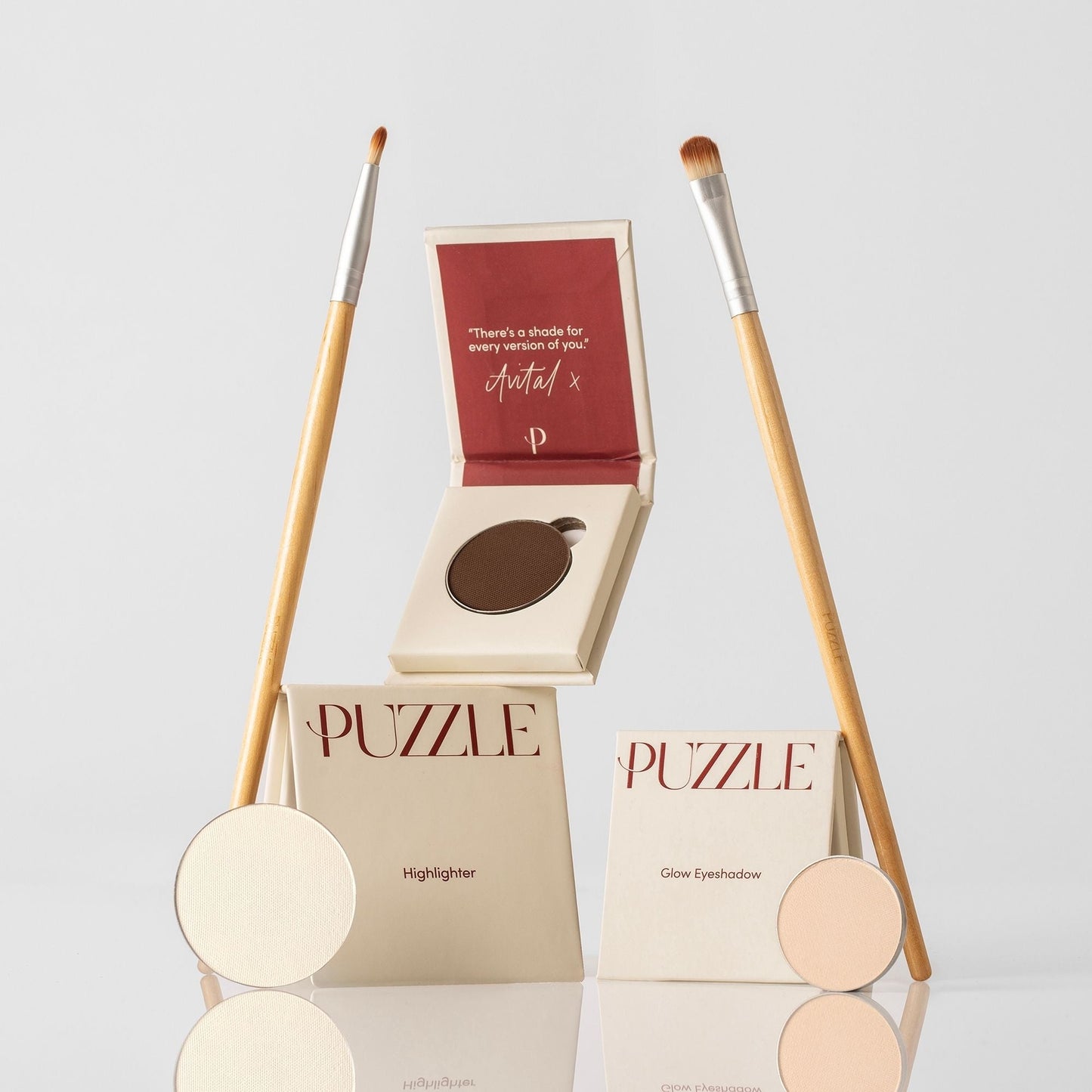 The Eye-Lift Kit featuring highlighter, glow eyeshadow, and applicator brushes for bright and defined eyes with effortless elegance.