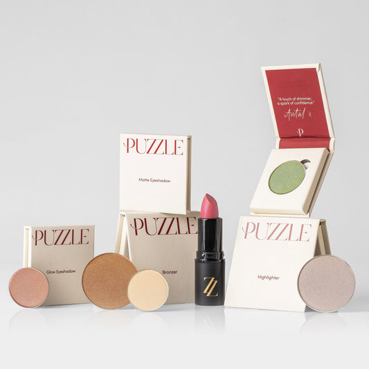 The Romance Edition featuring soft, dreamy hues of makeup products for a touch of timeless elegance, including lipstick and eyeshadow.