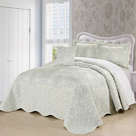 Queen size Antique White Damask Embroidered 4 Piece Oversized Bedspread Set on a neatly made bed in a stylish bedroom.
