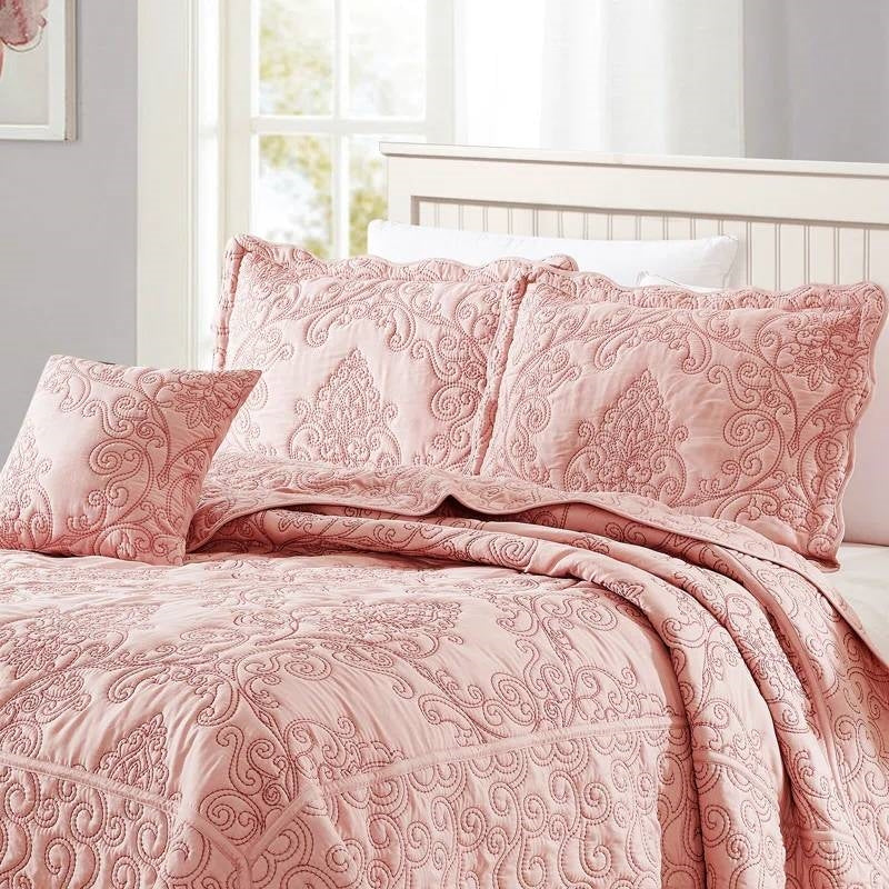 Queen size Dusty Pink Damask Embroidered 4 Piece Oversized Bedspread Set elegantly displayed on a bed.
