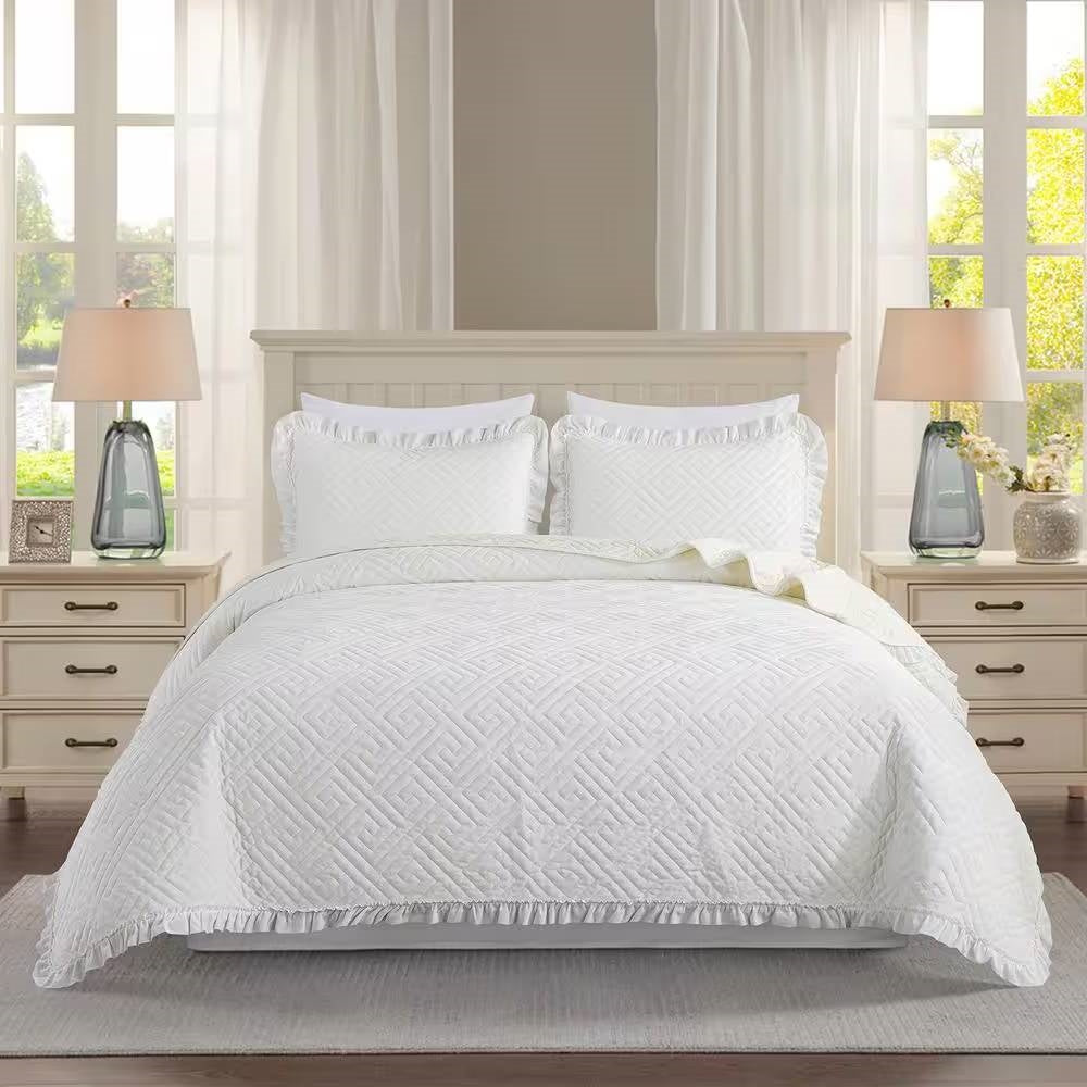 Queen size Ivory White Velvet Microfiber Polyester Reversible 3-Piece Quilt Set on bed with pillows and lamps