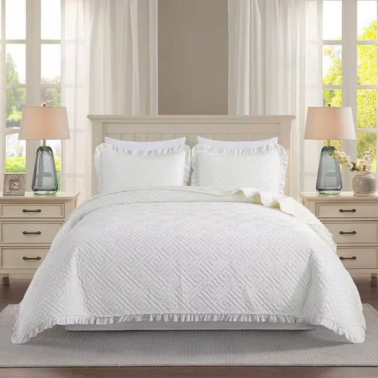 Queen size Ivory White Velvet Microfiber Polyester Reversible 3-Piece Quilt Set on bed with pillows and lamps