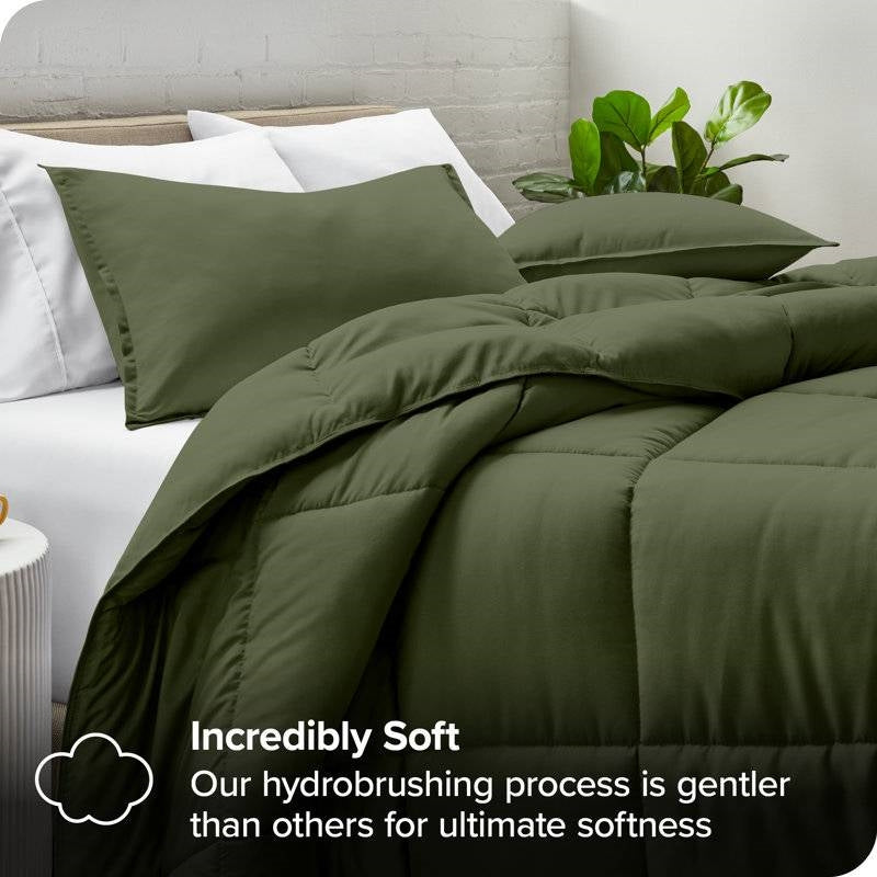 Queen size Hypoallergenic Down Alternative Comforter Set in Olive Green on a bed with pillows and plants