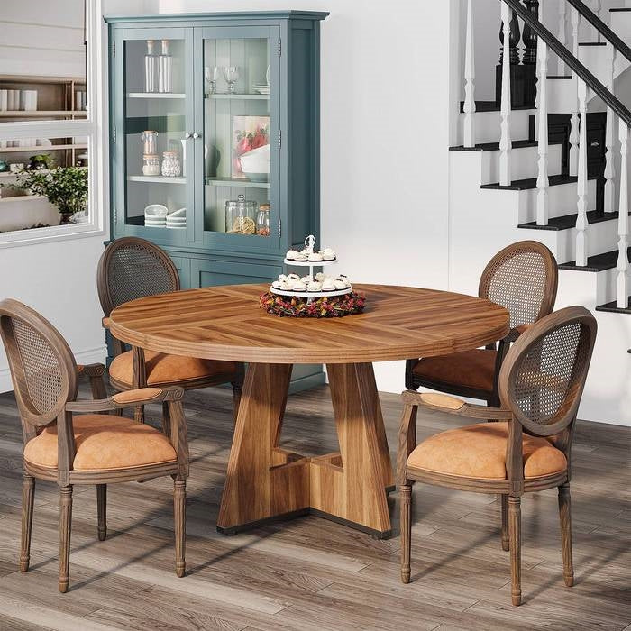 Farmhouse 47-inch Round Kitchen Dining Table in Vintage Brown Wood Finish with chairs in dining room setting.