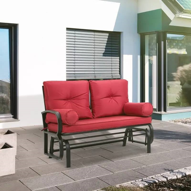 Steel Outdoor Garden Patio Rocking Glider Chair Loveseat with Red Cushions on a modern patio