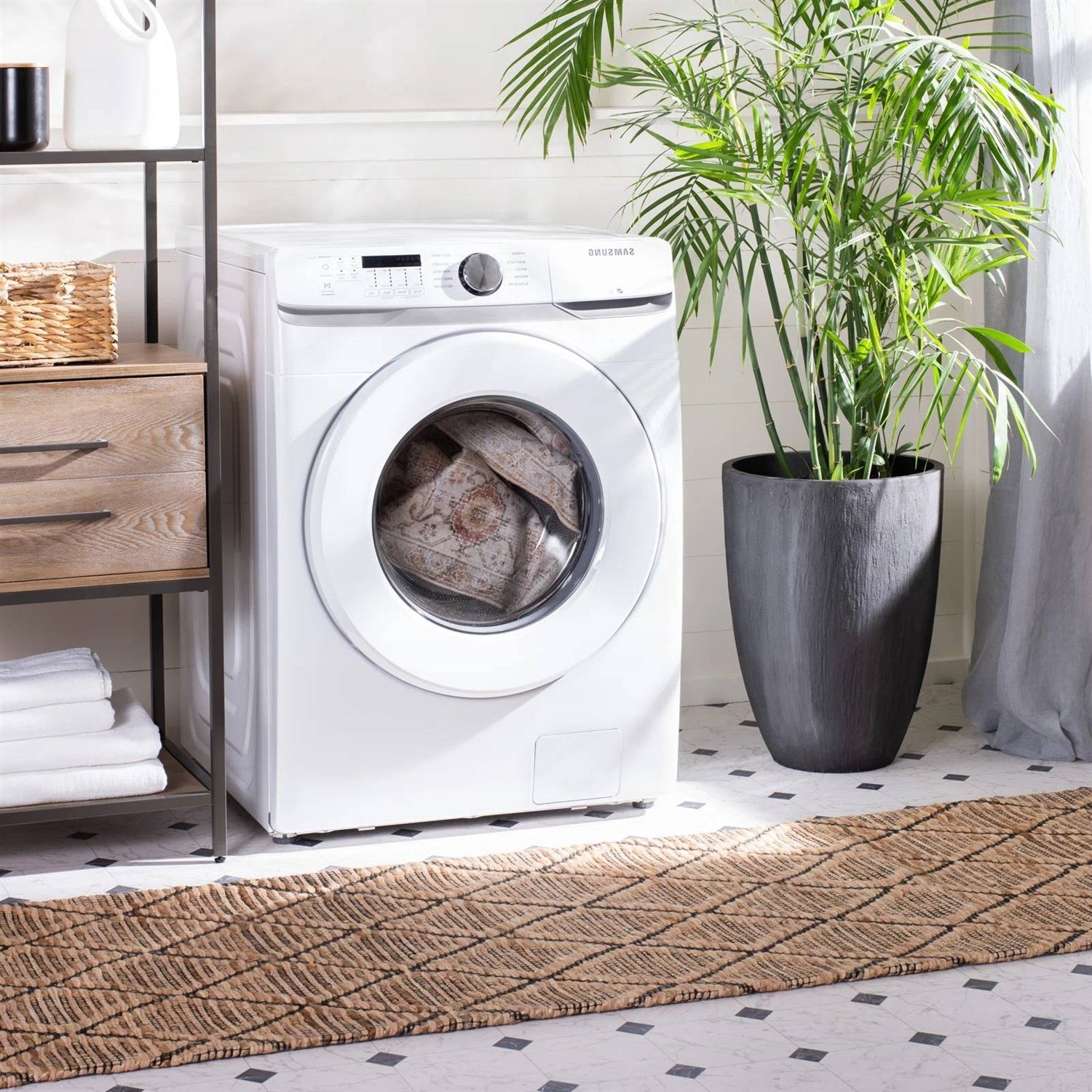 6 ft. x 9 ft. Traditional Persian Style Washable Boho Light Grey Red Area Rug in a washing machine next to a potted plant