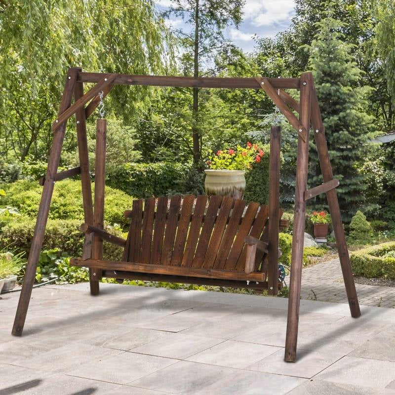 FarmHouse Log A-Frame 2-Seat Wooden Swing Bench in garden setting with rustic fir log construction and carbonized wood finish.