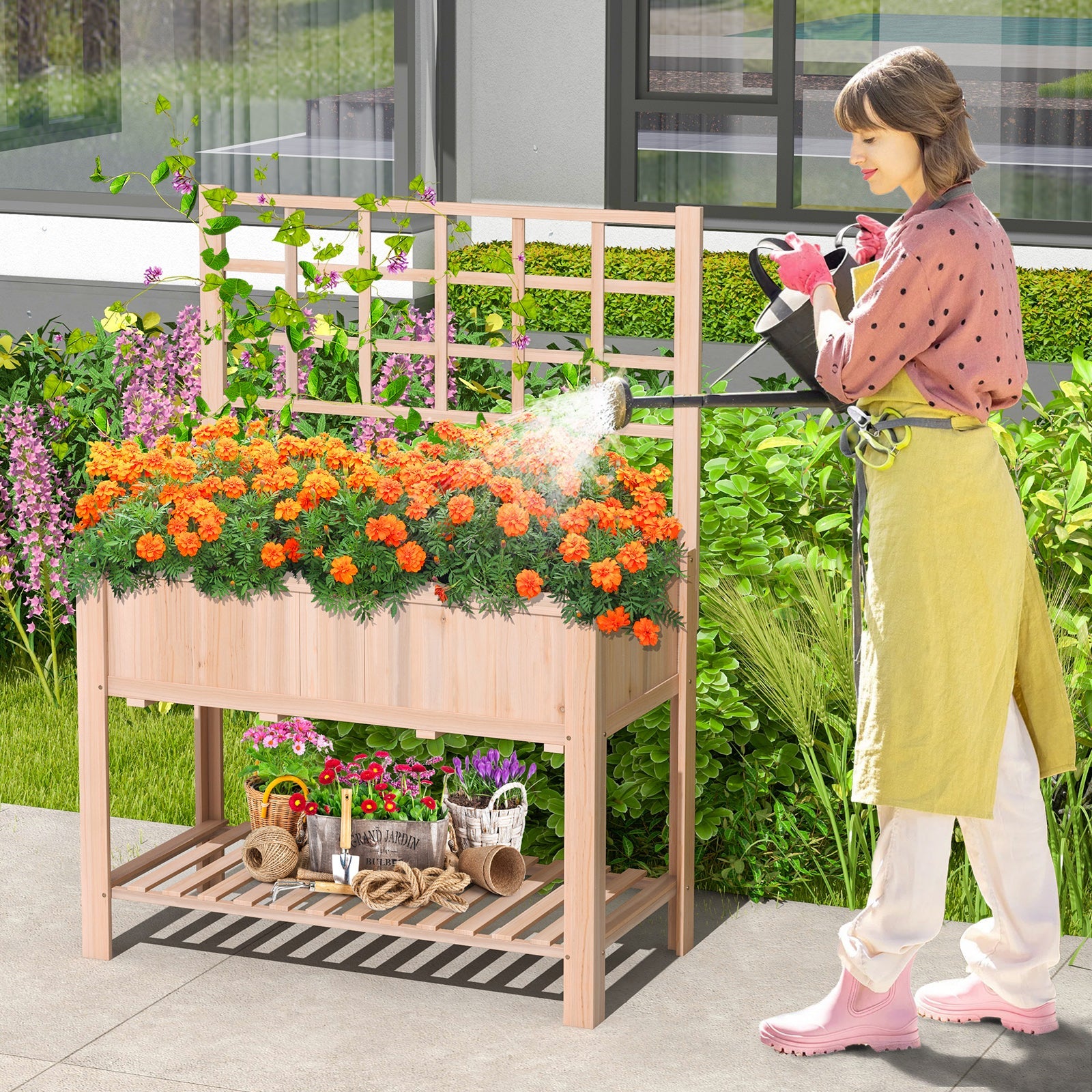 Raised Garden Bed Elevated Wooden Planter Box with Trellis in outdoor setting with flowers, woman gardening nearby.