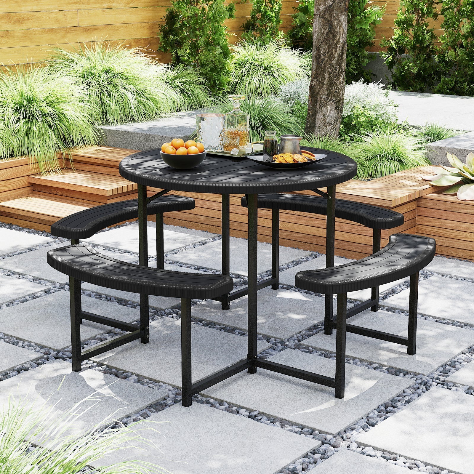 Round Picnic Table Bench Set with 4 Benches and Umbrella Hole for Patio Lawn-Black in garden setting