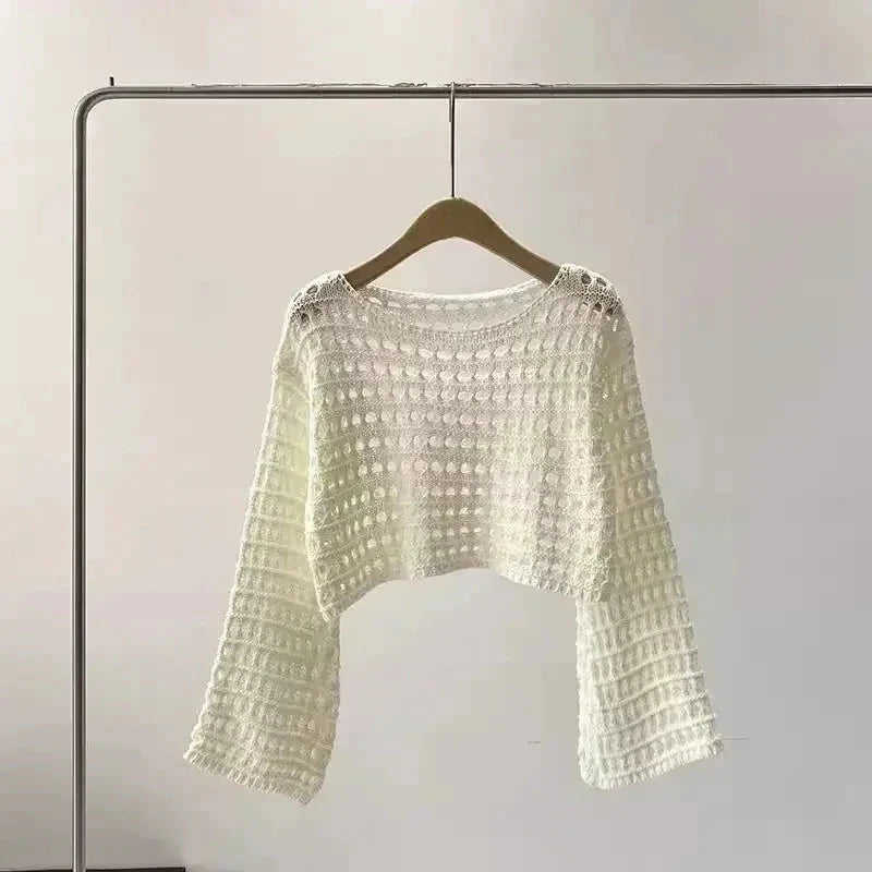 Boho chic women’s crochet knit beach cover up pullover on hanger, perfect for summer, festivals, and vacations.