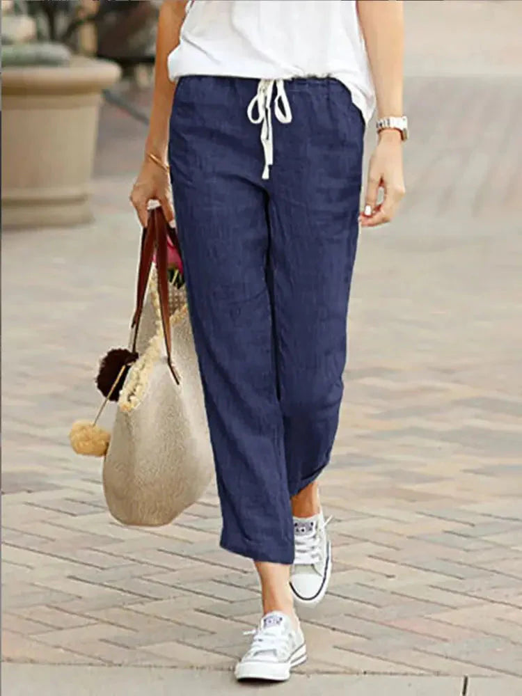 Model wearing Cotton Y2K Wide Leg Pants – High Waist Streetwear Baggy Trousers in navy blue, styled with a casual white top and sneakers.