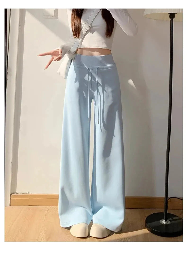 Woman wearing Gray High-Waist Loose Wide-Leg Straight Pants Women in a casual setting.