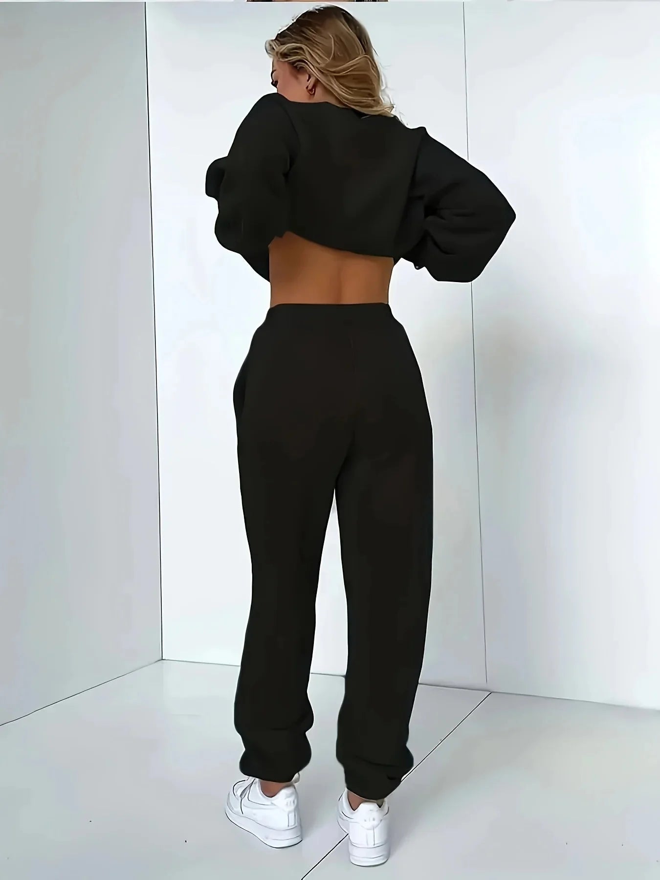 Back view of Women’s Plush Hoodie & Pants Sweater Set – Cozy Winter Tracksuit in black with white sneakers.