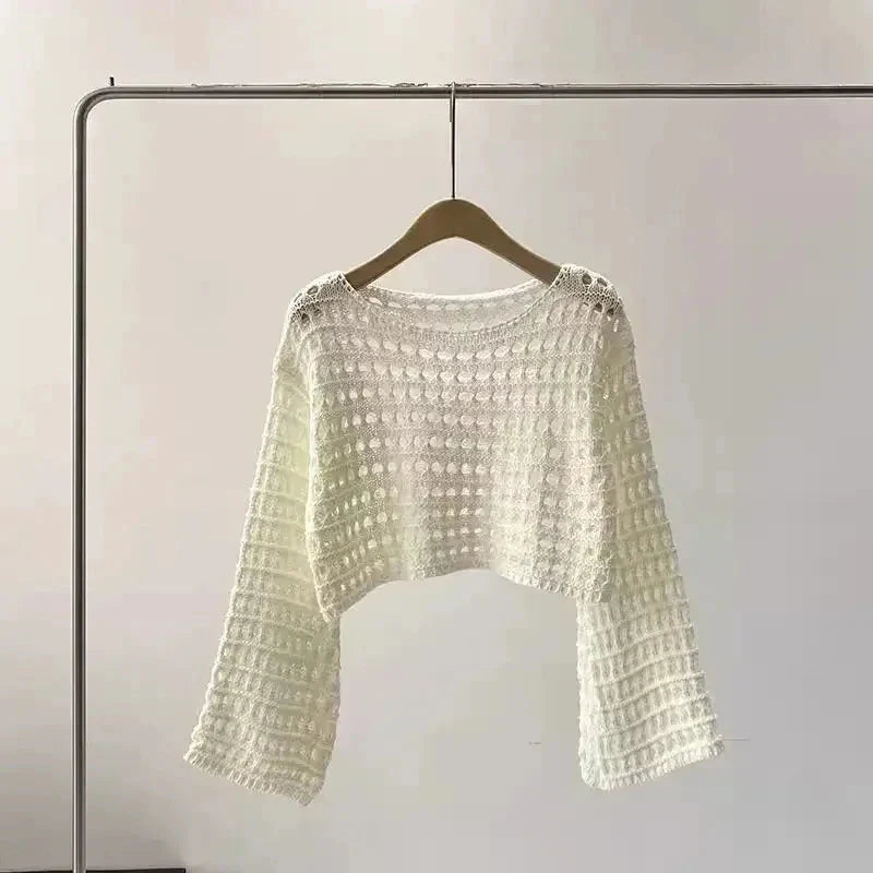 Women’s crochet knit beach cover up in white with long sleeves, ideal for summer style and comfort.