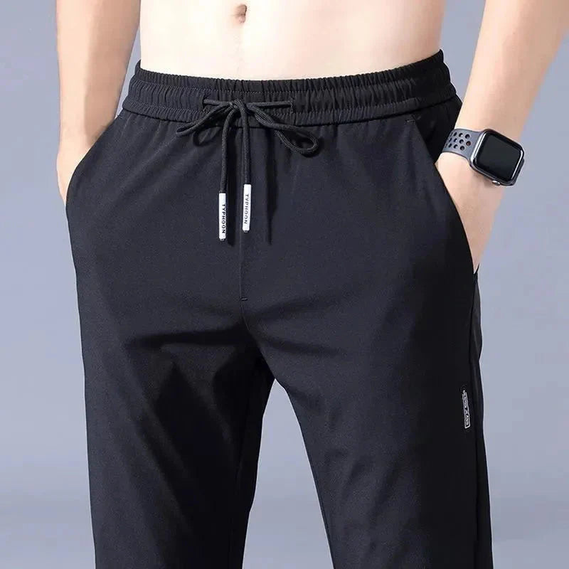 Slim Fit Stretch Jogger Pants with Elastic Waist in black, featuring stretch fabric and elastic waistband for comfort and style.