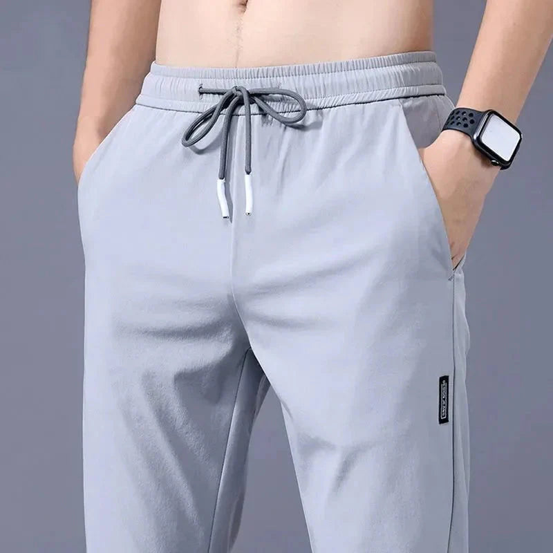 Gray Slim Fit Stretch Jogger Pants with Elastic Waist for casual wear and mobility.