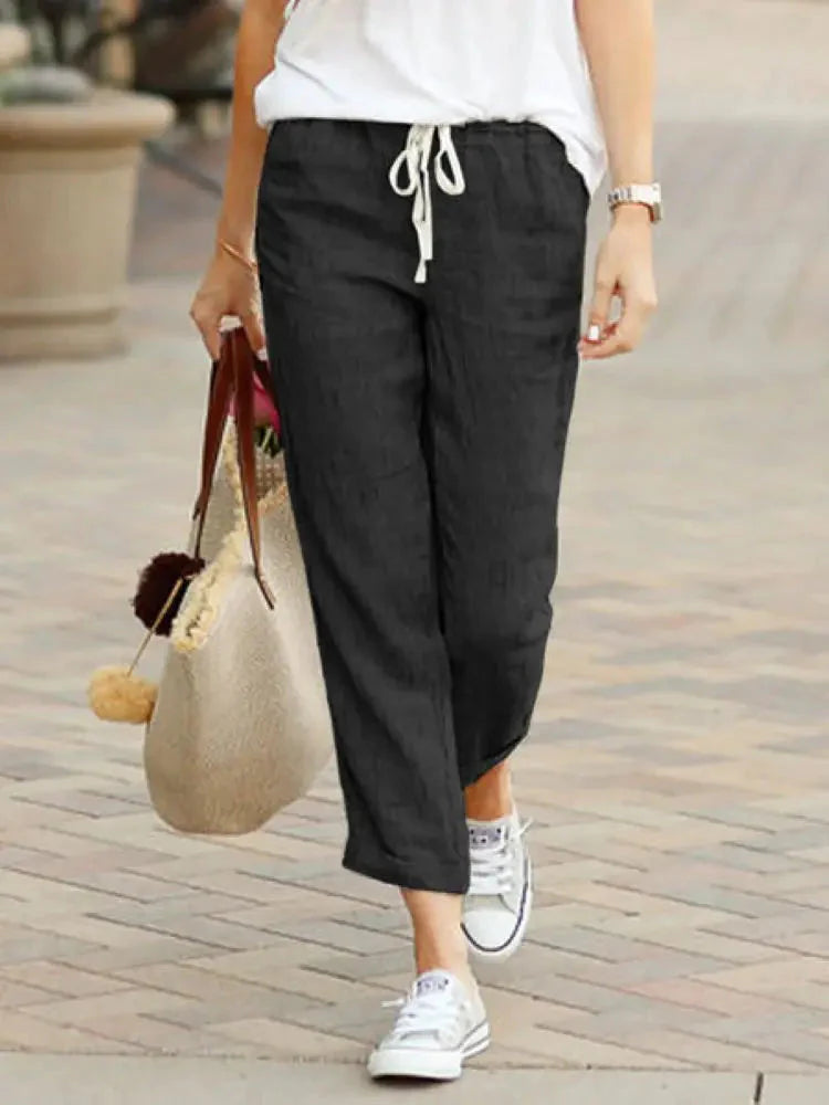 Woman wearing Cotton Y2K Wide Leg Pants – High Waist Streetwear Baggy Trousers with drawstring, casual style walking outdoors