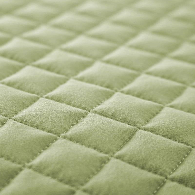 Close-up of Full/Queen Lightweight Sage Ultra Soft 3-Piece Microfiber Quilt Set showcasing quilted texture and sage color.