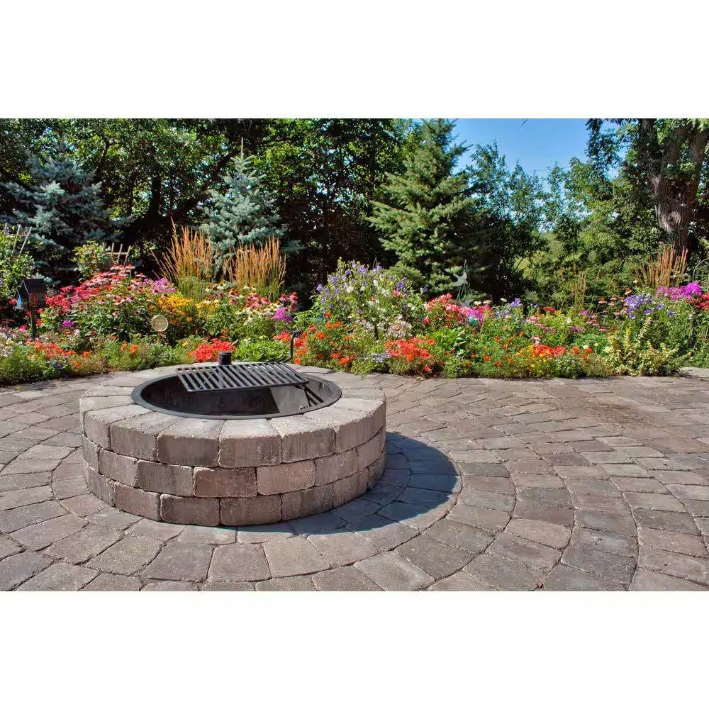 48-in Outdoor Round Concrete Block Stone Fire Pit Kit with Cooking Grill Grate in a garden setting, ready for backyard cookouts.