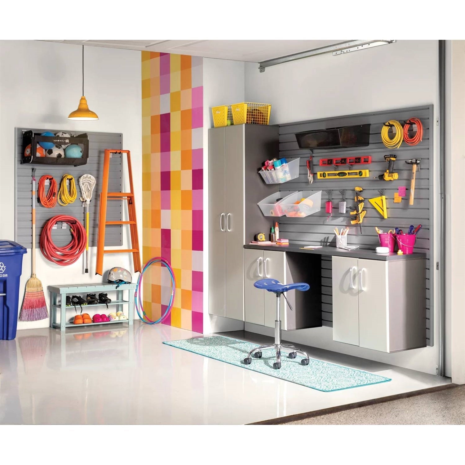 Organized garage with tools, ladder, and storage cabinets showcasing efficient space management