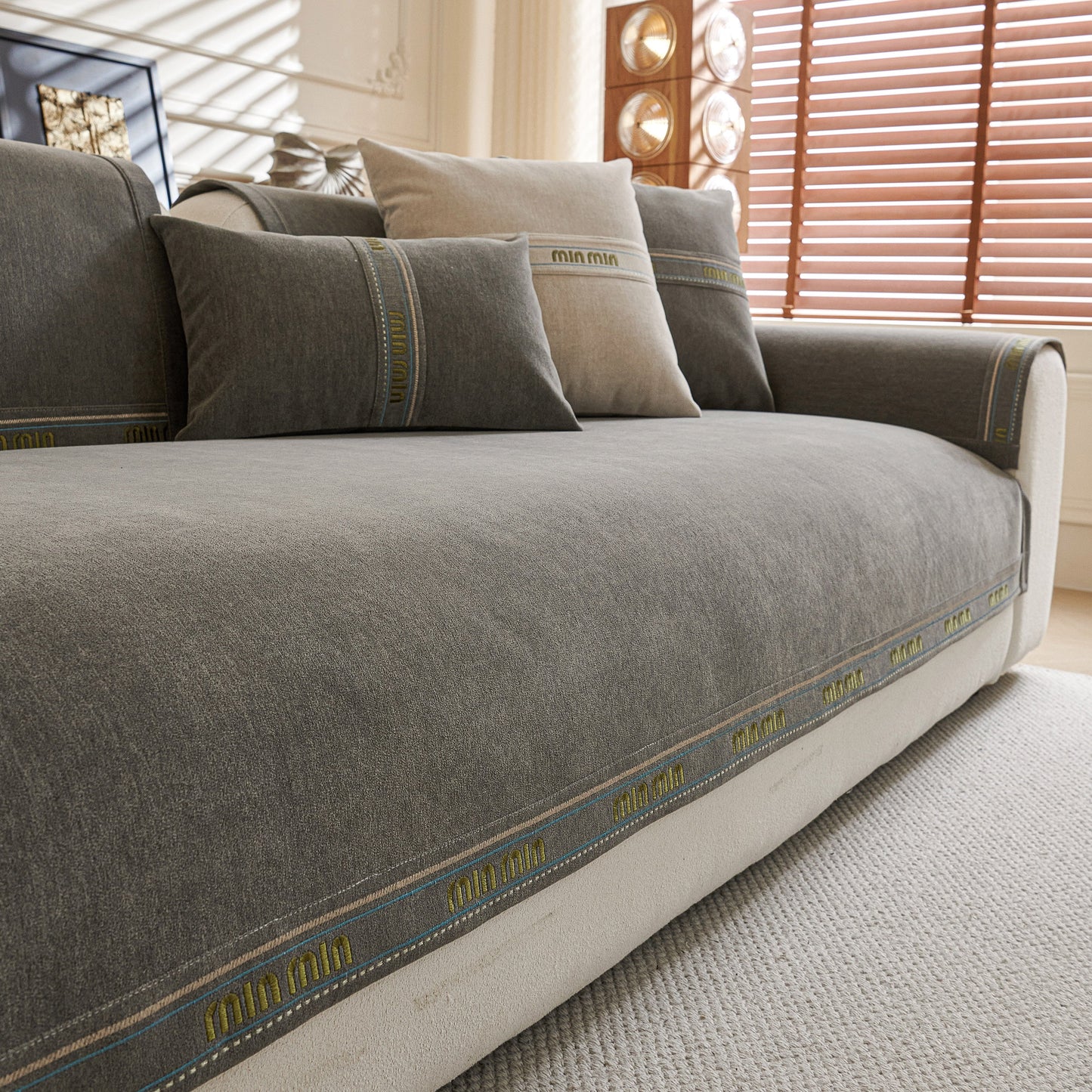 Chenille Sofa Cover Pet Mat, Non-Slip Couch Protector for Sectional & L-Shaped Sofas in grey with decorative stitching.