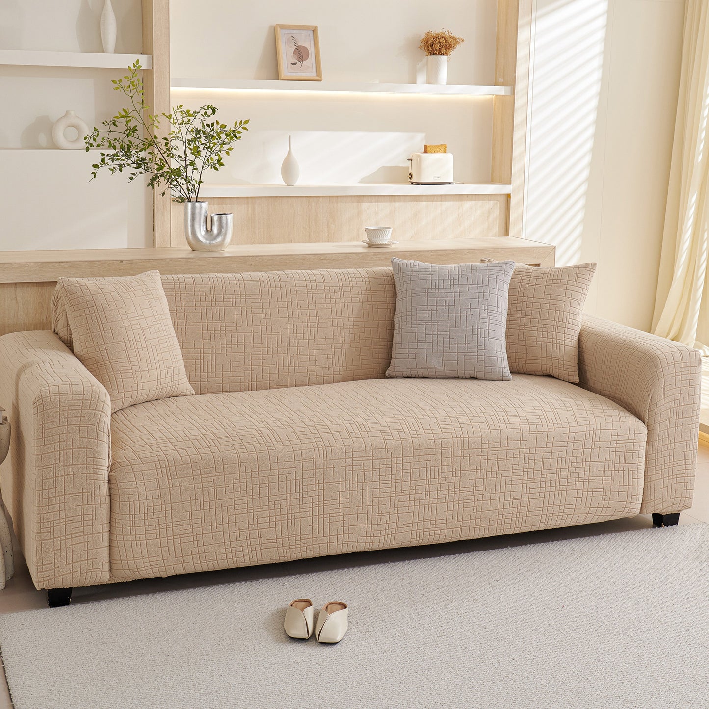 Beige couch with Embossed Lines Couch Covers Stretchable Non-Slip & Washable Sofa Slipcovers in a modern living room setting.