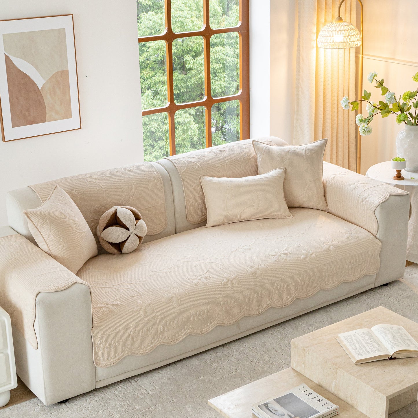 Floral Cotton Quilted Sofa Cover, Non-Slip Couch Protector with Scalloped Edges in a cozy living room setting.