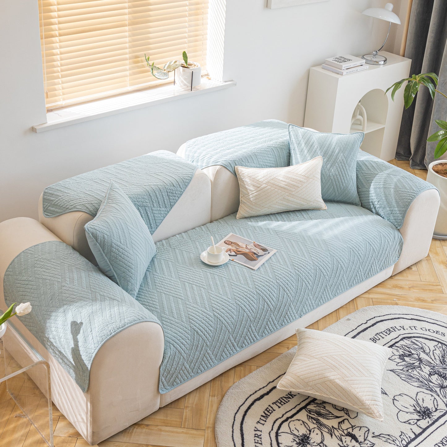 Quilted Geometric Cotton Sofa Cover, Non-Slip & Thick Padded Furniture Covers in light blue on a modern sofa.